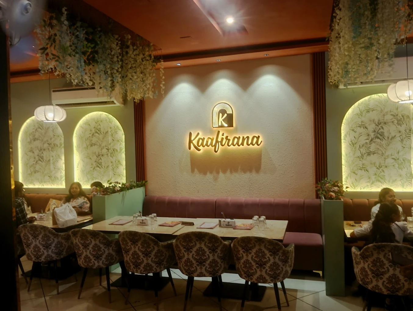 Interior view of the main seating area and Kaafirana logo