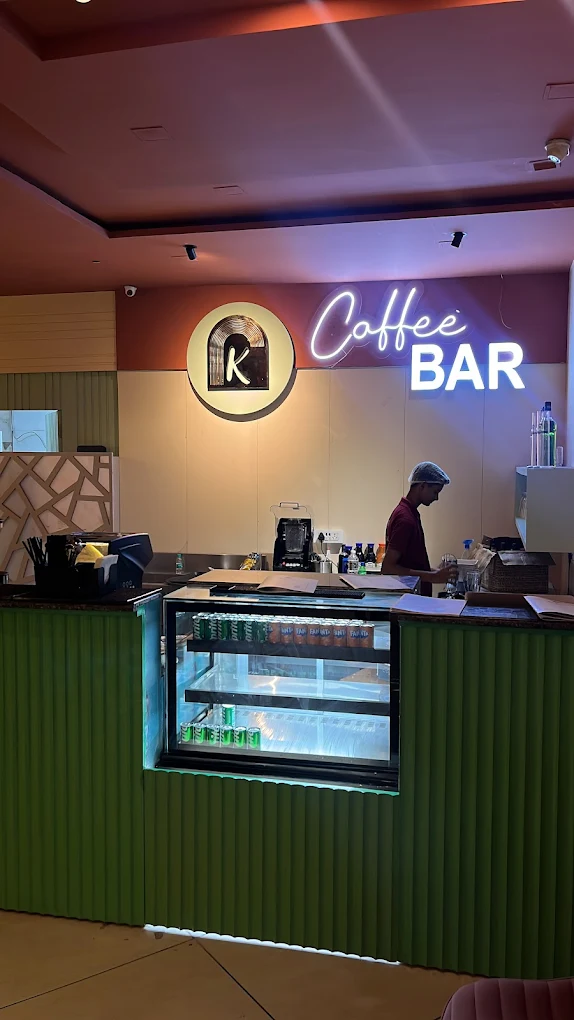 Coffee bar with neon sign and serving counter