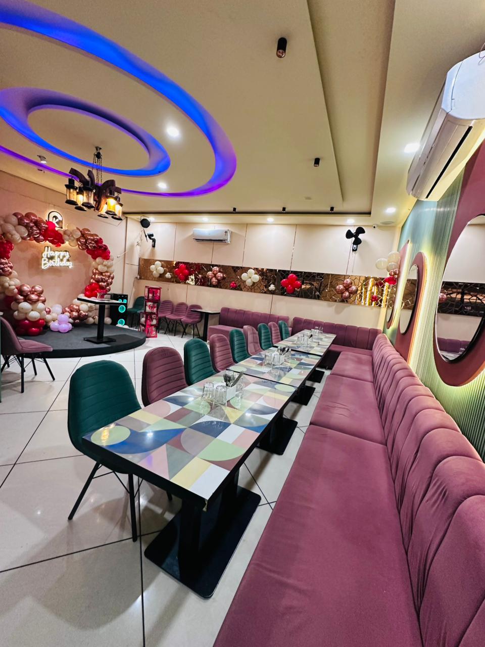 Wide view of Kaafirana party hall with birthday setup